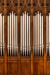 Obraz premium Ornate Pipe Organ Detail with Gothic Wood Carving 