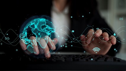 This image showcases hands typing on a keyboard, accompanied by a digital world map and technology icons, symbolizing global communication and connectivity in the modern world. Xenic