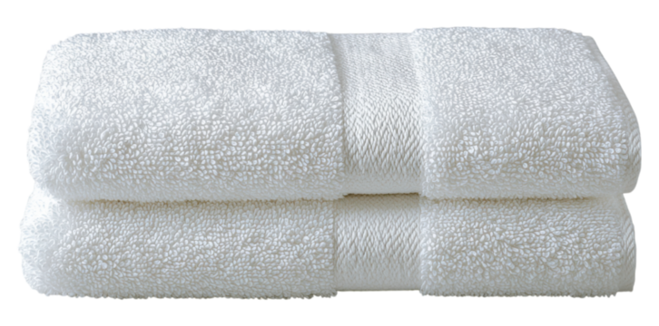 Soft, fluffy white towels stacked neatly, showcasing their texture and quality.
