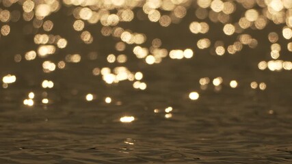 Water Sun Glimmer: Golden sunset reflections on calm water surface, creating bokeh effect. - Powered by Adobe