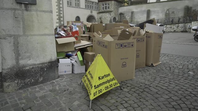 Karton sammelplatz Schweiz. Well-organized cardboard recycling point in Schaffhausen, Switzerland. Sustainable waste management and eco-friendly. Karton Sammelstelle in Altstadt. Recycling. 