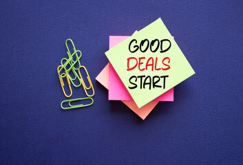 Good Deals Start symbol. Sticky Notes with words Good Deals Start. Beautiful deep blue background....