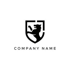Powerful wolf or canine animal silhouette within a stylized shield emblem logo.