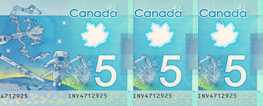 5 Dollars Canada, 2013 with the image of Dextre and canadarm2. International Space Station. Polymer money of Canada. - Powered by Adobe