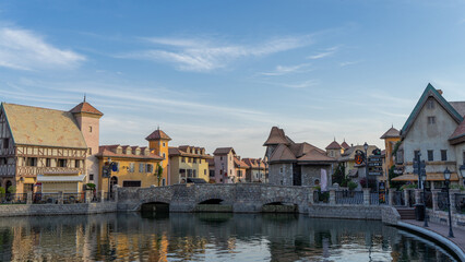 Walking area with shops and restaurants in United Arab Emirates. Riverland, Dubai. Houses and bridge in style of medieval Europe