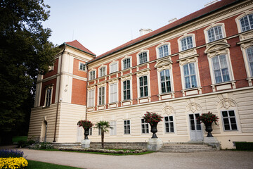 Elegant historic building surrounded by a lush garden in Lancut, Poland