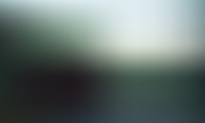 Softly blurred green and white abstract background with gentle gradient and subtle lighting effects