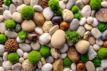 Assortment of natural stones and green moss isolated on white background