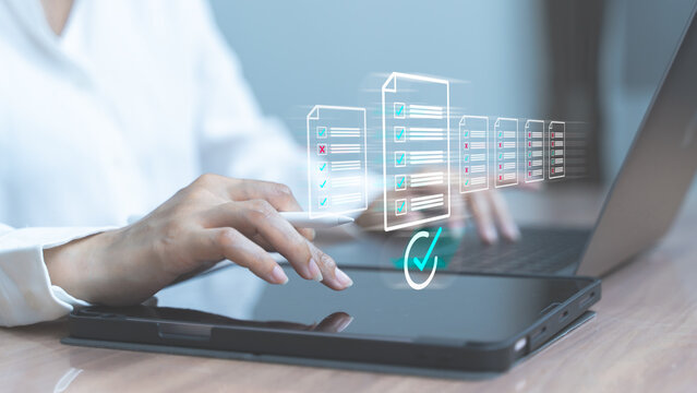 Woman interacting with laptop showing virtual database icons and green check mark symbolizing cloud data validation and access.
