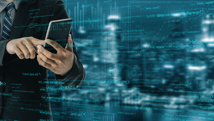 A businessman in a suit interacts with a smartphone amidst a digital data backdrop, representing modern communication and technology in an urban night setting. Xenic