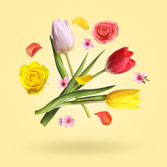 Aromatic flowers and petals in air against pale yellow background