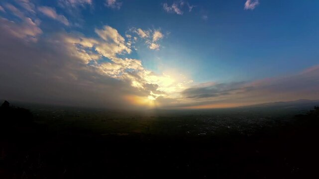 Sunrise over cholula, puebla, mexico with clouds moving fast