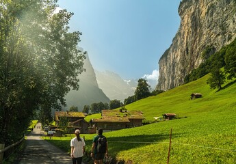 A hike through the Lauterbrunnen Valley in Switzerland among the impressive mountains on a sunny day