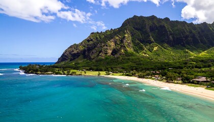 Aerial View of a Lush Green Mountain Overlooking a Tropical Beach and Turquoise Ocean.