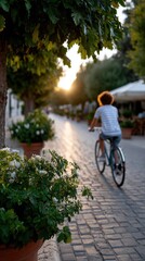 urban morning cycling, a lady rides her bike down a vehicle-free street with greenery and cafes in lively morning light in a vertical scene