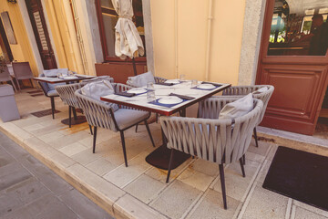 Empty outdoor seating at a traditional greek restaurant in corfu.