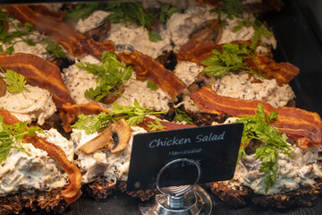 Smørrebrød, open-faced sandwiches, is a beloved part of Danish cuisine and considered a traditional national dish in Denmark.