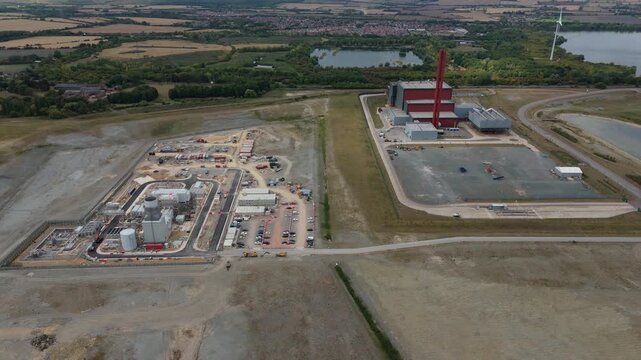Aerial drone view of Millbrook and Rookery industrial power plant, energy generation from gas and oil, smoke stacks, Bedford England UK