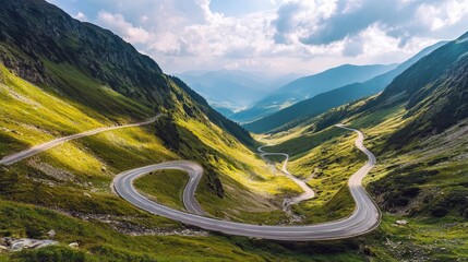 Winding mountain road through lush valleys.