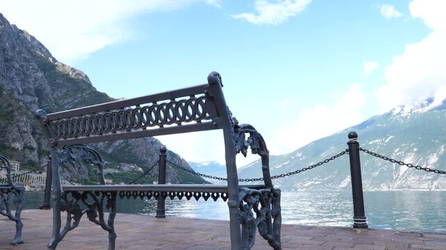 A chair bench overlooking Lake Garda at Limone, Italy