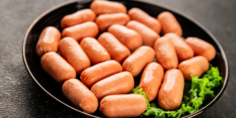 Mini sausages fresh delicious processed meat tasty snack fresh delicious gourmet food background on the table rustic food top view copy space