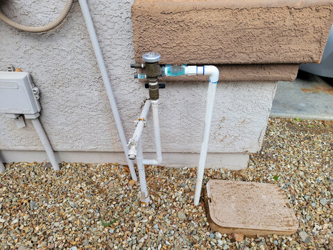 Branching pipes connecting house water supply and drop irrigation system