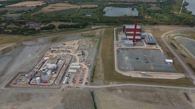 Aerial drone view of Millbrook and Rookery industrial power plant, energy generation from gas and oil, smoke stacks, Bedford England UK