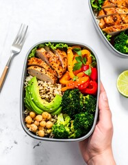 Healthy lunchbox with grilled chicken and vegetables