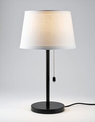 Table Lamp with a Cloth Shade on Dark Surface with a Neutral Background in Studio