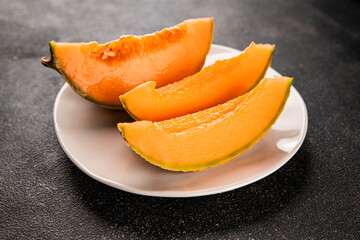 Melon Charente ripe sweet fruit tasty snack fresh delicious gourmet food background on the table rustic food top view copy space keto and paleo diet vegan and vegetarian food