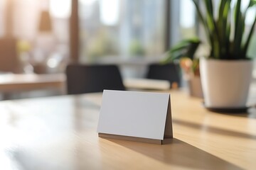Blank tabletop sign on wooden desk bathed in warm sunlight, ready for your custom message