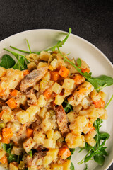 Potato salad with smoked fish tasty snack fresh delicious gourmet food background on the table rustic food top view copy space