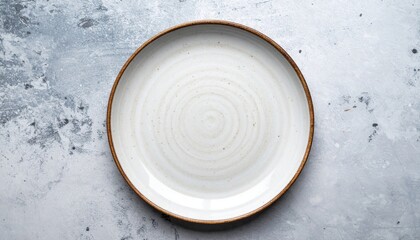 Close Up Overhead Shot of a White Ceramic Plate on a Gray Textured Background
