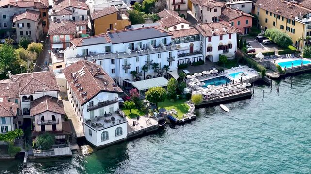Sulzano town in Monte Isola, Lake Iseo or Lago d'Iseo. Beautiful island in Lombardy, Italy. Aerial 4K drone video footage