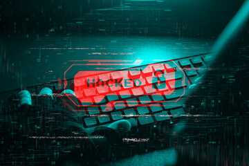 Cyber Attack system hacked concept. Hacker hands typing on a keyboard with a glowing red warning sign HACKED.