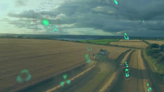 Animation of eco icons and data processing over countryside farm land