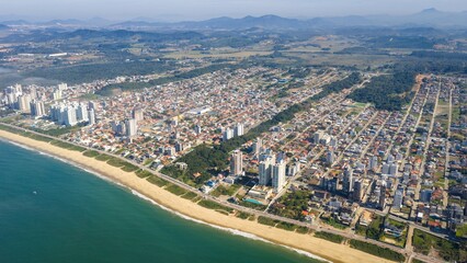High aerial view of Balneário Piçarras coastline and urban grid.