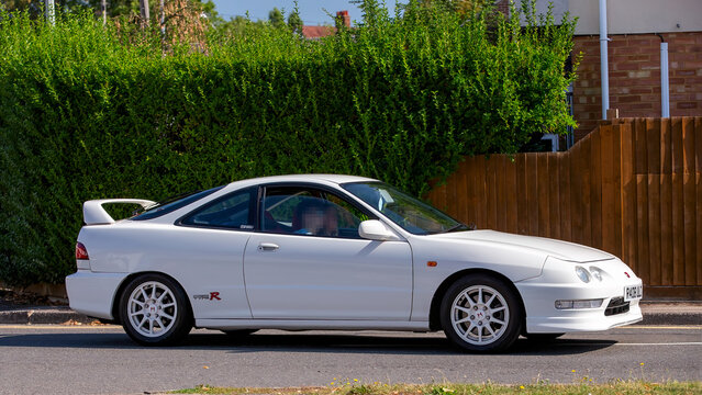 Bletchley,Bucks,UK - Aug 25th 2025:   1998 white Honda Integra car driving on a British road