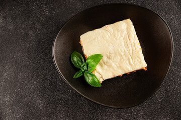 Lasagna bolognese béchamel sauce, meat, cheese second course tasty snack fresh delicious gourmet food background on the table rustic food top view copy space