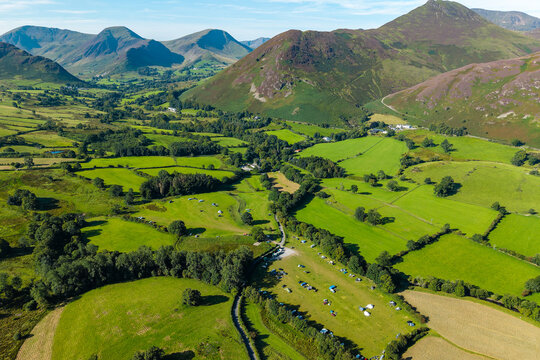 Aerial drone view of a summer pop-up campsite in the scenic Newlands Valley, Lake District