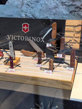 Display of intricately designed multitools in a vibrant outdoor setting