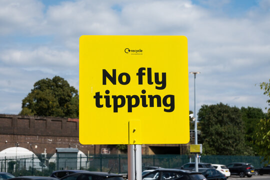 London, UK, August 23rd 2025:A yellow council No fly tipping sign. Environment, waste dumping, pollution and breaking the law.