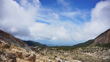 Natural rocky slope of Papandayan Mountain, showcasing volcanic landscape in West Java.