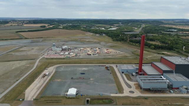 Aerial drone view of Millbrook and Rookery industrial power plant, energy generation from gas and oil, smoke stacks, Bedford England UK