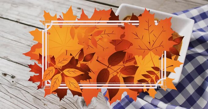 Animation of frame with fall leaves over bowl with dip