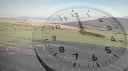 Animation of moving clock over landscape - Powered by Adobe