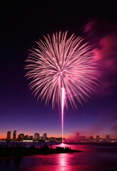 Vibrant pink fireworks burst over a city skyline at dusk, reflecting beautifully on the water, creating a breathtaking evening spectacle.