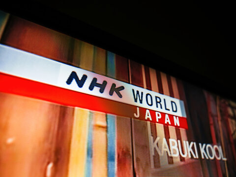 Haarlem, Netherlands - Aug 29, 2019: NHK World Japan logo on a high-definition UHD screen, showcasing vibrant colors and detailed pixels, transmitted via satellite and digital services.