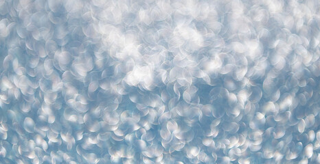 Blurred defocused background. Blur glitter backdrop. Glitter shimmer background. Defocused shimmer. Bokeh backdrop shimmer. Bokeh effect. Glitter shine. Bokeh shimmering background. Sparkling glitter