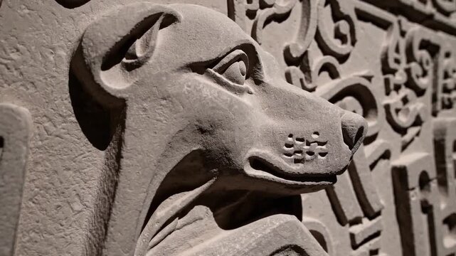 Sculptural relief artwork originating from ancient burial site dedicated to canine animals